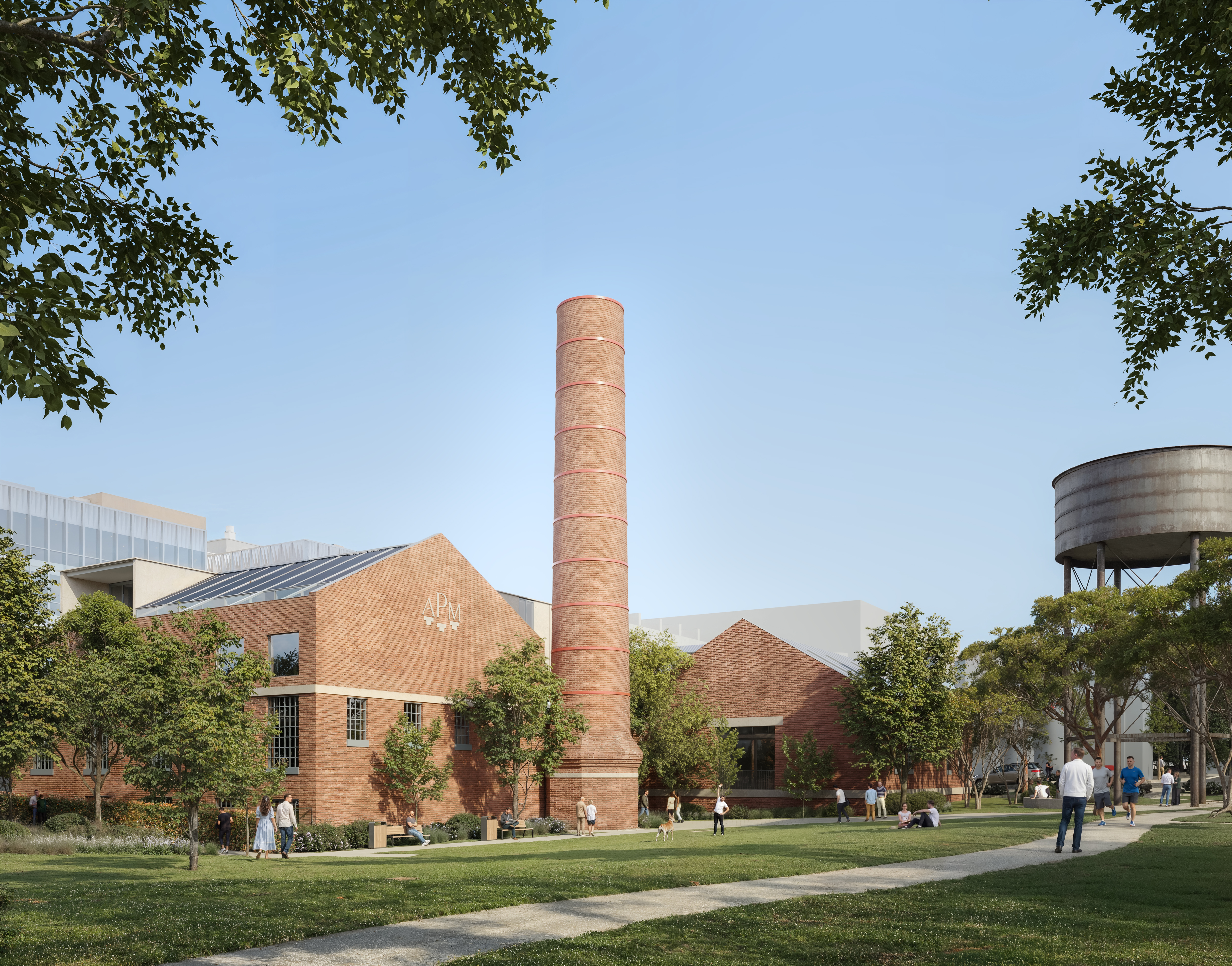 Heritage red brick building with park in foreground